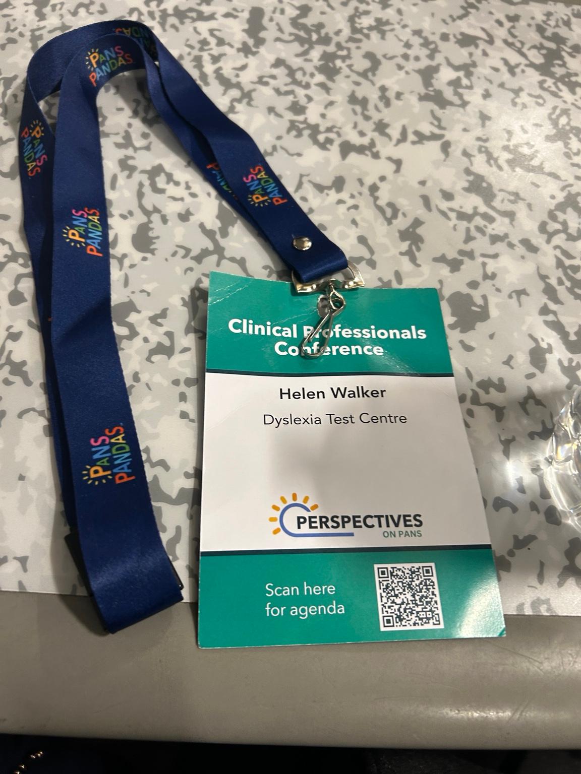 Helen Walker’s Clinical Professionals Conference delegate badge for Dyslexia Test Centre, with a PANS PANDAS UK lanyard
