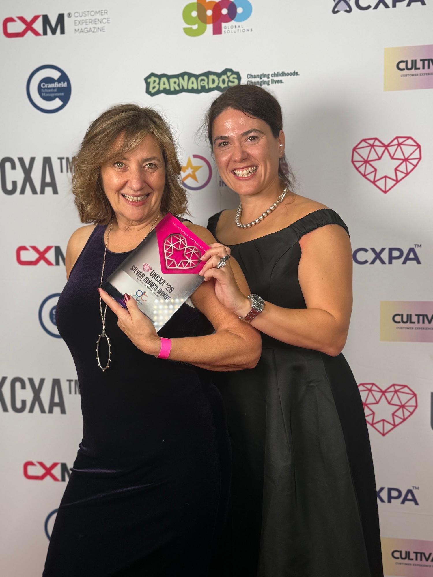Dyslexia Test Centre founders celebrating with their Silver award at the UK Customer Experience Awards 2026